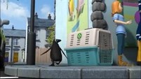 Unbeknownst to everyone else (arguing), the penguin sneaks away...
