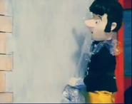 Another shot of Elvis unsuccessfully trying to stop water from shooting out of the broken tap