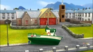 Charlie's boat marooned outside the Fire Station