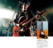 Photo from "Guitar Magazine". Focuses on Shinji's guitar from the night.