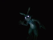 Glitchtrap dietro il lettore nella stanza delle registrazioni.