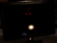 Suicide Mouse's ink-blot form's texture in the Office's monitor without the power and the flashlight on.