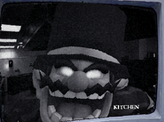 Wario in the Kitchen staring into the camera.