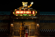 Freddy outside of Freddy Fazbear's Pizza, standing with Abby Schmidt