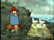 K'nuckles(left) holding one of his Maple Syrup bottles next to his parents