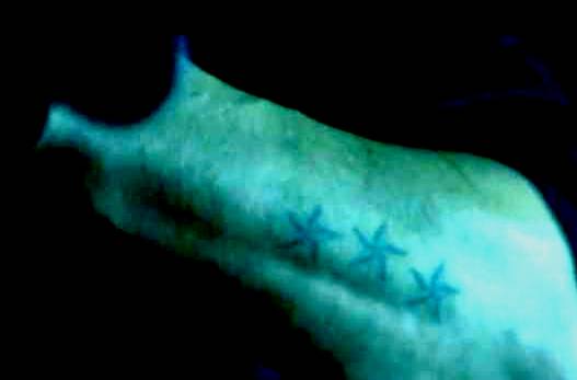 star tattoo on arm