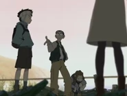 Naota and company discussing the cause of the fire.