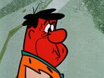 An angry and red-faced Fred with his cheeks puffed up, about to blow his top in the episode, "The Babysitters".