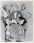 Jean Vander Pyl kissing Barney Rubble's nose along with Bea Benaderet, Wilma Flintstone and Betty Rubble from a publicity photo.