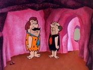 Mr. Slate (with two large tufts of brown hair behind his ears) and Fred, disguised as a janitor in the episode, "Moonlight and Maintenance".