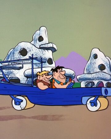 fred flintstone in his car