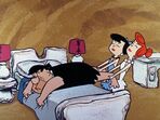 Betty and Wilma grabbing Fred's feet to get him up from his bed in the episode, "The X-Ray Story".