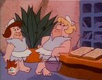 Fred and Barney disguised as maids at the Sandrock Beach Hotel in the episode, "Fred's Promise".