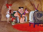 Fred, Wilma, Dino and Pebbles watching TV in "The House That Fred Built".