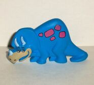 A 90s triceratops toy found inside Post Fruity/Cocoa Pebbles cereal boxes.