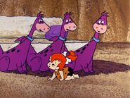 Pebbles looking for the real Dino with the look-alikes of him in the episode, "Dino Disappears".