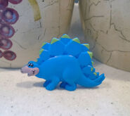 A 90s Stegosaurus toy found inside Post Fruity/Cocoa Pebbles cereal boxes.