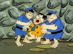 A panicked Fred being apprehended by prison guards in the episode, "Fred's Last Resort".