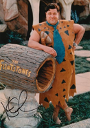 Fred Flintstone, portrayed by John Goodman.