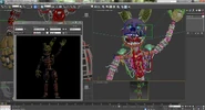 The Model of Springtrap from FNaF's 3rd Anniversary with his Freddy Fazbear's Pizzeria Simulator's versions hand in the bottom left.