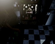Phantom Chica's face on the arcade machine's monitor in CAM 07.