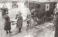 Red Cross workers remove a flu victim in St. Louis, Missouri (1918)