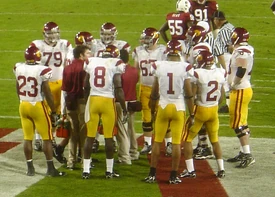 The 2006 Trojans in a huddle during a game against Stanford