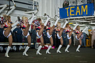 Seattle Seahawks cheerleaders, the Sea Gals, perform a dance routine for Sailors and Marines aboard the amphibious assau