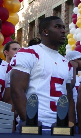 Reggie Bush, wearing a Will Smith jersey, leads Saints onto field