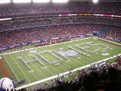 The  of Virginia Tech make the "HOKIES" formation during halftime