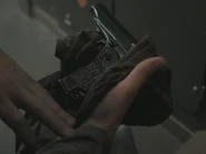 FAM 410 17.50 Nate finds Makarov.png (1.23 MB) Lowry discovering the pistol