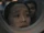 FAM 308 21.57 Kelly Baldwin through porthole.png