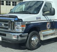 The 2015-2019 Ford E-350 Cutaway Van Exterior shown in Oxford White equipped with the High-Series Exterior Upgrade package with 16" Stainless Steel Wheel Covers