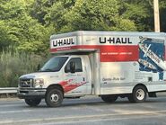 The 2011 Ford E-350 Cutaway Van Exterior shown in Oxford White equipped with the High-Series Exterior Upgrade package with 16" x 6" White-Painted Steel Wheels