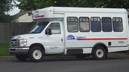 The 2009 Ford E-350 Cutaway Van Exterior shown in Oxford White with the High-Series Exterior Upgrade Package with a Passenger Side Door Deleted and 16" x 7" White-Painted Steel Wheels used on Coach and Equipment Phoenix ML Wheelchair-Equipped Shuttle Buses