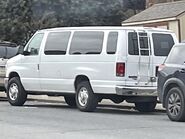 The 2011 Ford E-350 XL Extended Passenger Van Exterior Shown in Oxford White equipped with the XL High-Series Exterior Upgrade Package with Swing Out Passenger Side Cargo Doors, Rear Swing Out Cargo Doors and 16" Steel Wheels with Full Sport Wheel Covers