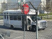 The 2019 Ford E-350 158" Dual-Rear Wheelbase Cutaway Van Exterior shown in Oxford White equipped with the High-Series Exterior Upgrade package with a Passenger Side Door Deleted and 16" x 6" White-Painted Steel Wheels used on Turtle Top Terra Transit Wheelchair-equipped Shuttle Buses