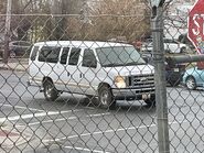 The 2012-2013 Ford E-350 XLT Extended Passenger Van Exterior Shown in Oxford White with Swing Out Passenger Side Cargo Doors, Rear Swing Out Cargo Doors and 16" Aluminum Wheels with Chrome Center Caps