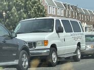 The 2003-2004 Ford E-350 XLT Extended Passenger Van Exterior Shown in Oxford White with Swing Out Passenger Side Cargo Doors, Rear Swing Out Cargo Doors and 16" Steel Wheels with Full Sport Wheel Covers