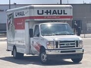 The 2021-2024 Ford E-350 Cutaway Van Exterior shown in Oxford White equipped with the High-Series Exterior Upgrade package with 16" x 6" White-Painted Steel Wheels