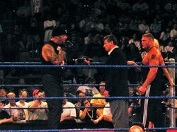 Undertaker, Vince McMahon, Brock Lesnar, & Sable in a WWE ring