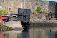 Dock scene set, with blue-screen in front of armored boat (courtesy PhotoGraft).