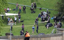 Crew and actors dressed as warriors getting ready.