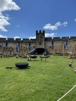 Setting up a market scene and banners inside the castle.