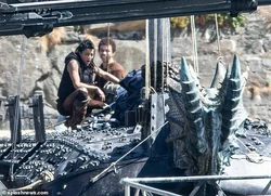 Michelle Rodriguez and Justice Smith on the armored boat.