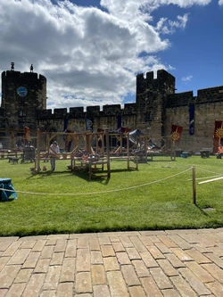 Setting up a market scene and banners inside the castle.