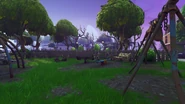 An old rusty park with swings and seesaws.