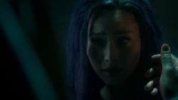 Erg pushes Clarice's hair back to reveal her pointed ears