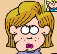 Frontal view of Eileen eating jam.