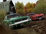 A 1968 Ford Mustang GT races a 1971 Ford Mustang Mach I through the corn field.